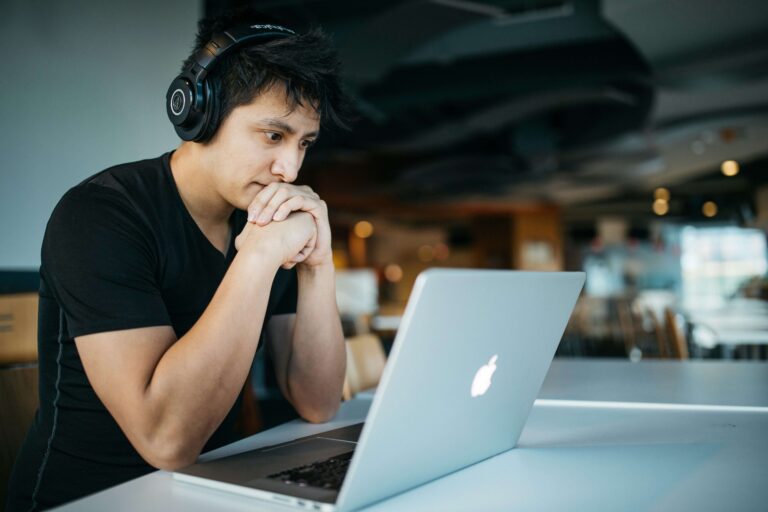 student sitting and watching laptop